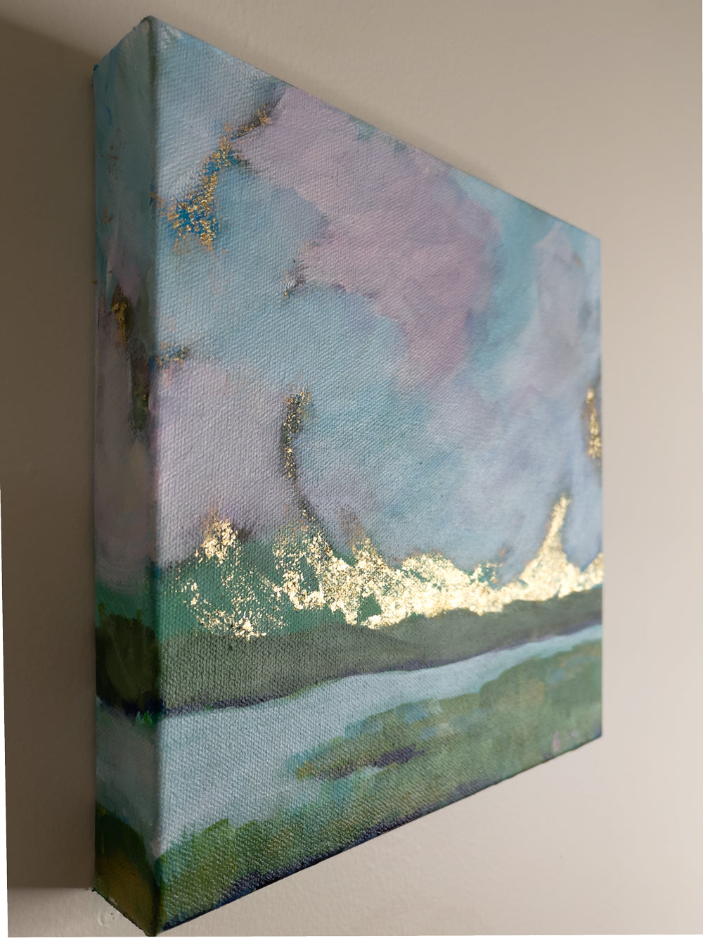 8" x 8"
Gallery wrapped canvas
Acrylic paint and gold leaf
Experience a slice of Maine with Coastal III.
This original landscape painting beautifully captures the deep green marshes, blue and pink skies, and golden sunrise with a modern impressionistic touch.
Hang it up and transform your space into a serene and stunning escape.