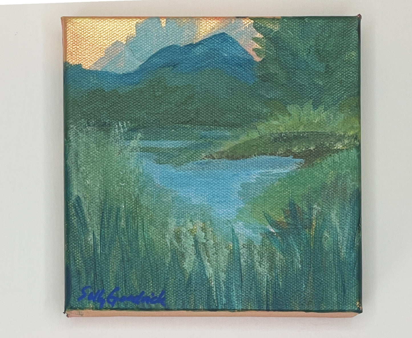 gold leaf landscape painting on canvas of mountains lake with trees and grasses
