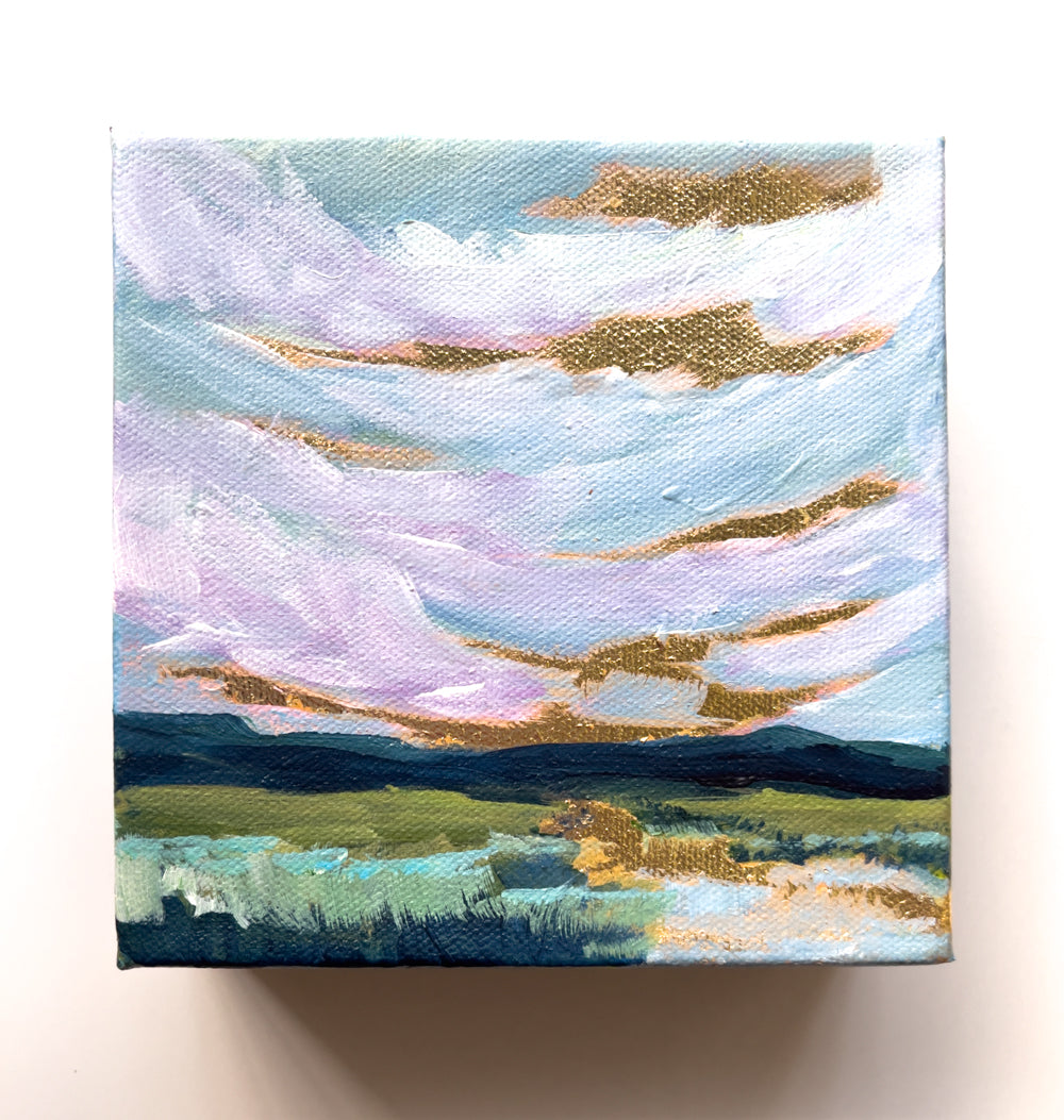Take a stroll with this impressionist painting capturing a pink and gold sunrise over the Blue Ridge Mountains.
The reflection of gold in the fresh water stream, lined with native reeds and grasses, provides a serene escape for any art lover.
(Nature at its finest!)