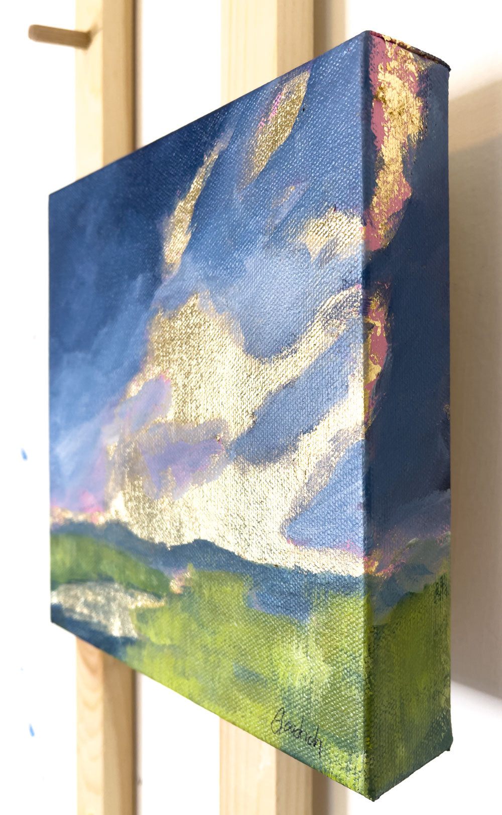 8" x 8"
Gallery wrapped canvas
Acrylic paint and gold leaf
Impressive: Capture the mood of spring with moody clouds, April showers, and a golden sunrise.
Let the gray-blue clouds and reflections of gold in the stream transport you to the lush blue ridge mountains, surrounded by vibrant yellow-green marsh grasses.