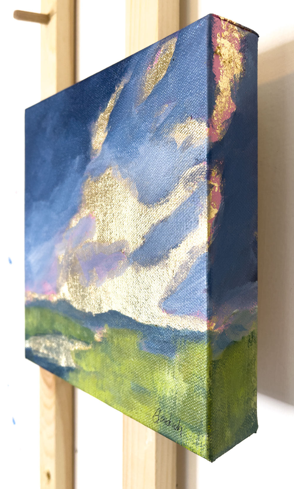 8" x 8"
Gallery wrapped canvas
Acrylic paint and gold leaf
Impressive: Capture the mood of spring with moody clouds, April showers, and a golden sunrise.
Let the gray-blue clouds and reflections of gold in the stream transport you to the lush blue ridge mountains, surrounded by vibrant yellow-green marsh grasses.