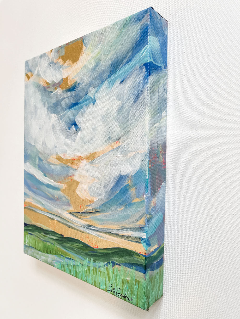  9" x 12" x1.5"
Gallery wrapped canvas
Acrylic paint and gold leaf
Capture the poetic beauty of the Blue Ridge Mountains with our Lyrical Lace painting!
This painting is an impressionist masterpiece made with gold leaf and a breathtaking cloudscape, amidst dramatic reeds, grasses and peek-a-boo splashes of red, blue, white, and green.
Take home this canvas-style work of art today and enjoy all the lyricism of nature!