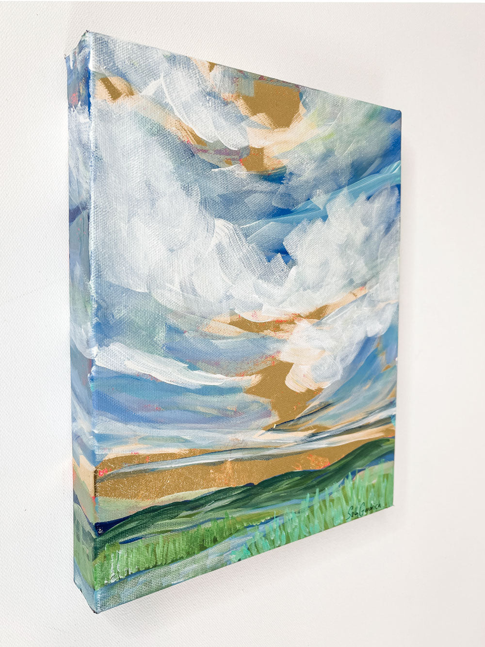  9" x 12" x1.5"
Gallery wrapped canvas
Acrylic paint and gold leaf
Capture the poetic beauty of the Blue Ridge Mountains with our Lyrical Lace painting!
This painting is an impressionist masterpiece made with gold leaf and a breathtaking cloudscape, amidst dramatic reeds, grasses and peek-a-boo splashes of red, blue, white, and green.
Take home this canvas-style work of art today and enjoy all the lyricism of nature!