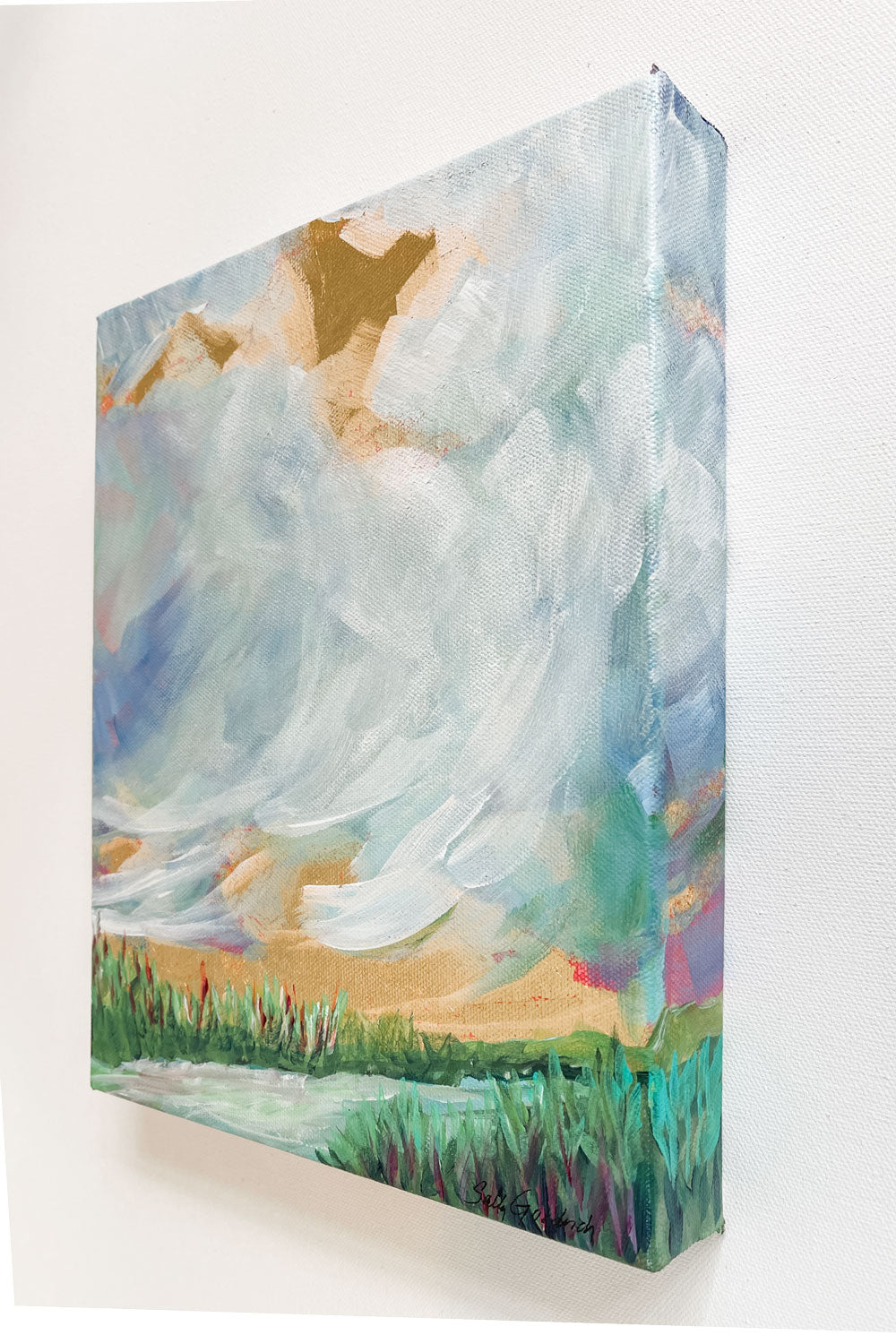 9" x 12" x1.5"
Gallery wrapped canvas
Acrylic paint and gold leaf
Step into a world of serenity with "Magnificent Obsession"!
This small painting combines the beauty of cloudscapes with blues, gold leaf, a stream, grasses, greens, whites, and turquoises, making it a joy to behold.
Plus, its mixed media elements are sure to take you to another place - no passport required! 