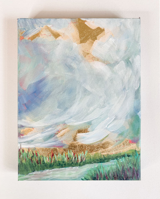 9" x 12" x1.5"
Gallery wrapped canvas
Acrylic paint and gold leaf
Step into a world of serenity with "Magnificent Obsession"!
This small painting combines the beauty of cloudscapes with blues, gold leaf, a stream, grasses, greens, whites, and turquoises, making it a joy to behold.
Plus, its mixed media elements are sure to take you to another place - no passport required! 