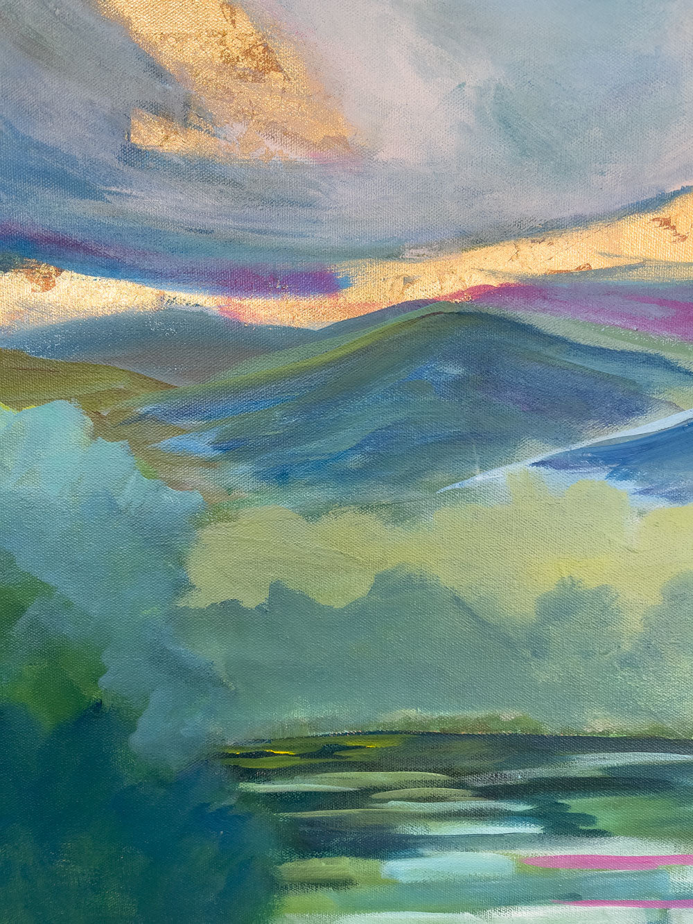 36" x 36"
Acrylic and Gold Leaf on Gallery Wrapped Canvas
Add a spark of nature to your home with Mountain Spring, a modern canvas painting featuring an impressionistic view of a serene lake surrounded by the blue ridge mountains and a fresh forest.
The dramatic sky with swirling clouds and a stunning gold leaf sunrise will instantly transport you to a peaceful and refreshing state of mind.