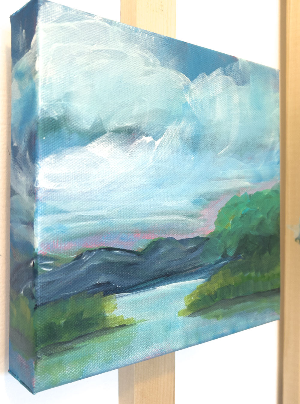 8" x 8"
Acrylic on Gallery Wrapped Canvas
Explore the "outer reaches" with this modern impressionistic landscape painting.
Admire the blue ridge mountains, serene lake view, and lush grove of trees.
Southern charm and a touch of whimsy await in this unique piece, featuring picturesque lake shore grasses and a tranquil marsh.