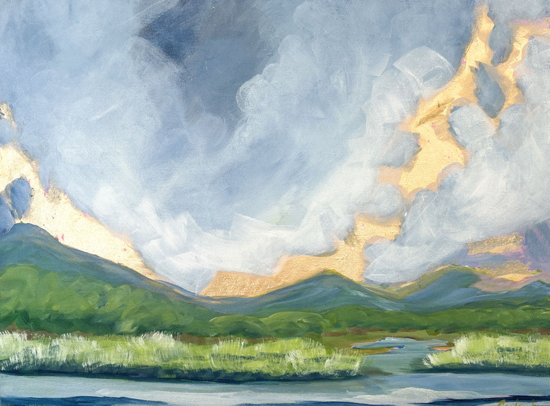 24" x 18" gold leaf landscape painting by Sally J Goodrich. A mix of gold leaf and acrylic paint create gorgeous landscape of the blue ridge mountains. A dramatic moody blue sky with gold rising sun highlights over the mountains, behind native trees and shrubs banking a babbling brook through a field of native grasses.