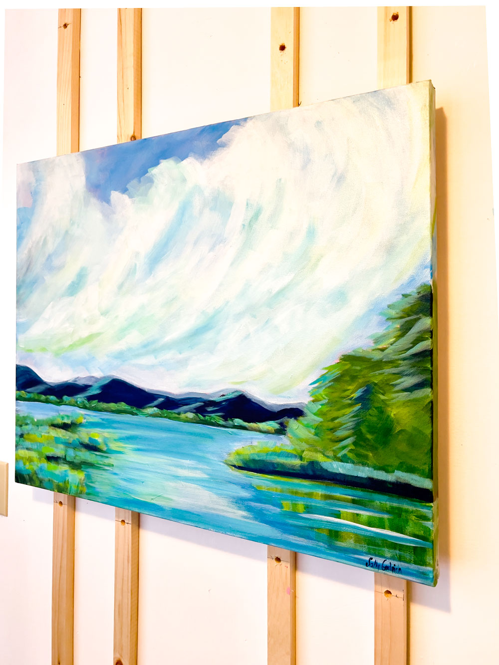 30" x 24"
Acrylic on Gallery Wrapped Canvas
Experience an ever-changing canvas with Perspectives.
Inspired by the tranquil views of the Blue Ridge Mountains, our large painting captures the serene blues and greens of the lake, accented by billowing white clouds and lush marsh grasses.
Take a journey through the woods without leaving your home with this unique piece."