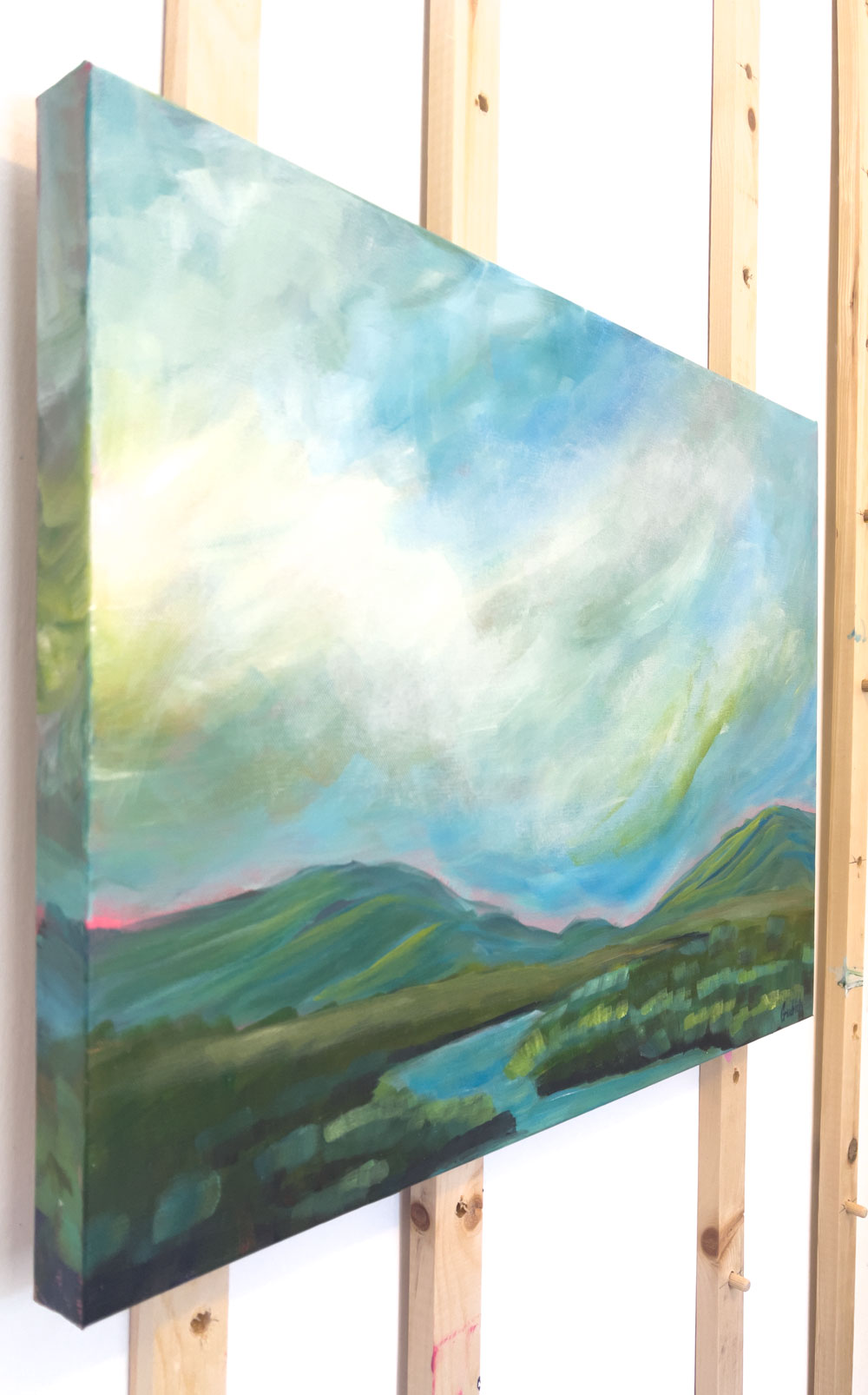 24" x 18"
acrylic on gallery wrapped canvas
Get lost in the serene beauty of this "Reading Room" with a dramatic acrylic painting of the Blue Ridge Mountains and a gentle blue stream.
The cool tones of blues, greens, and turquoises are complemented by a vibrant pink sunrise and waving grasses.
Perfect for a large room, this piece will bring a peaceful and tranquil atmosphere to your space.