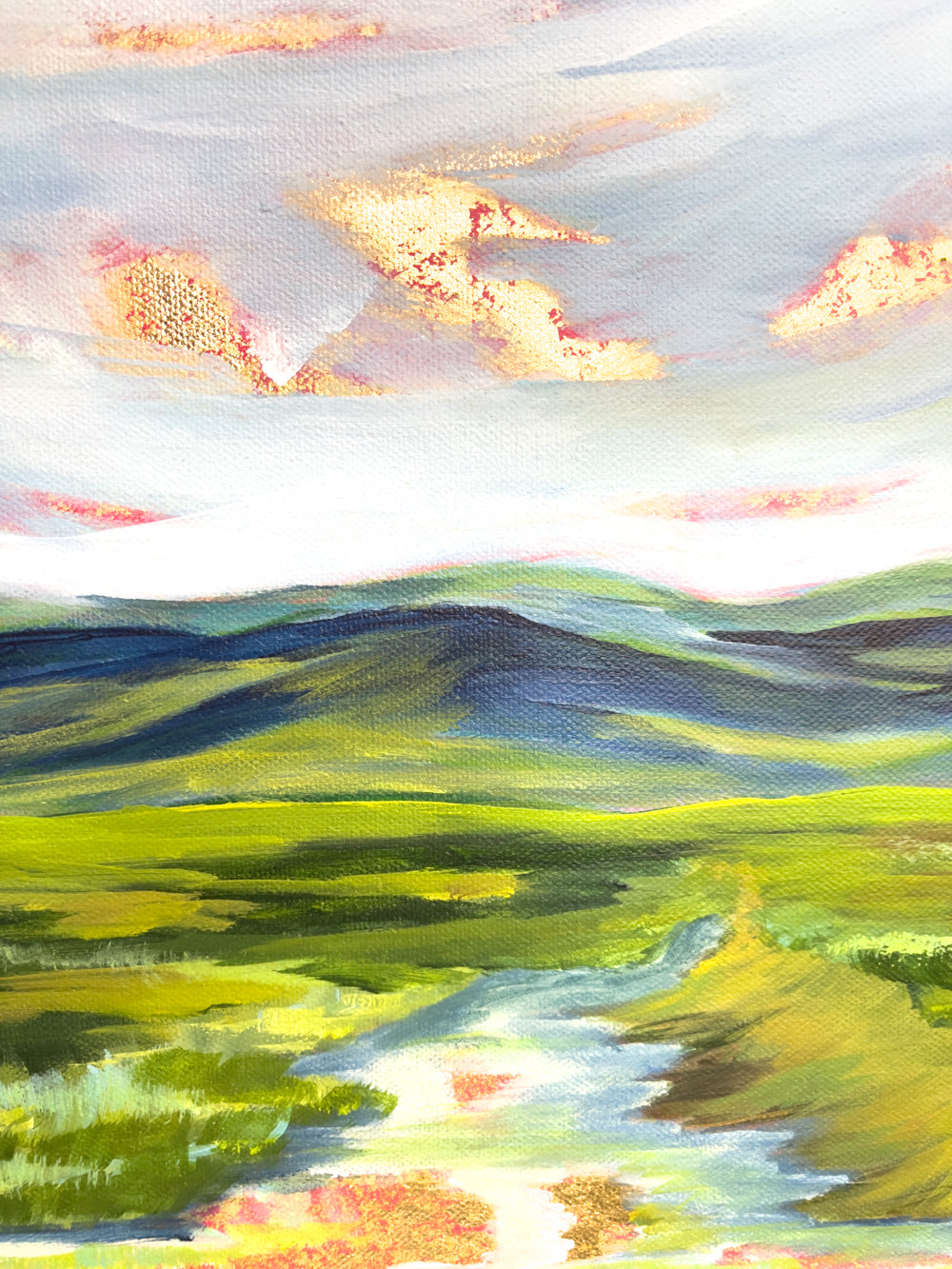 18" x 24"
Acrylic and gold leaf on wrapped canvas
Experience the majesty of the Blue Ridge Mountains with Worlds Apart!
This original modern abstract landscape features a blue and white sky with a gold leaf sun rising, while the mountains and green fields are brought to life with colorful impressionist strokes.
The gold leaf sky is even reflected in the stream, surrounded by lush native grasses.
A stunning piece for any art lover!