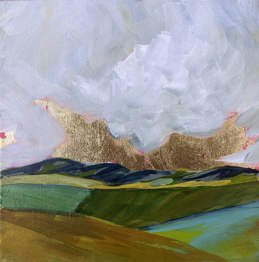 Abstract landscape painting with gold mountains and blue sky