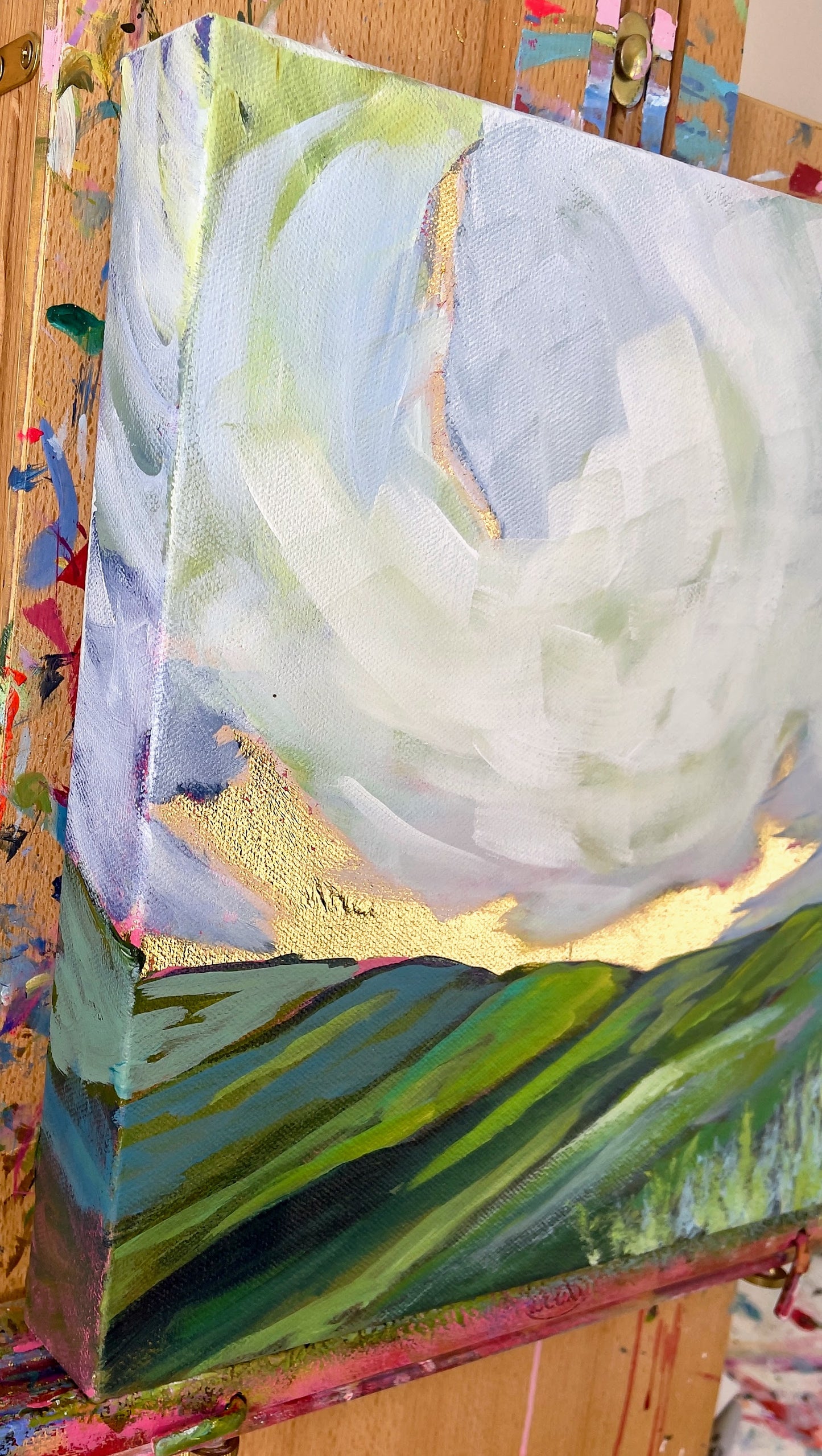 Colorful abstract painting on a wooden surface